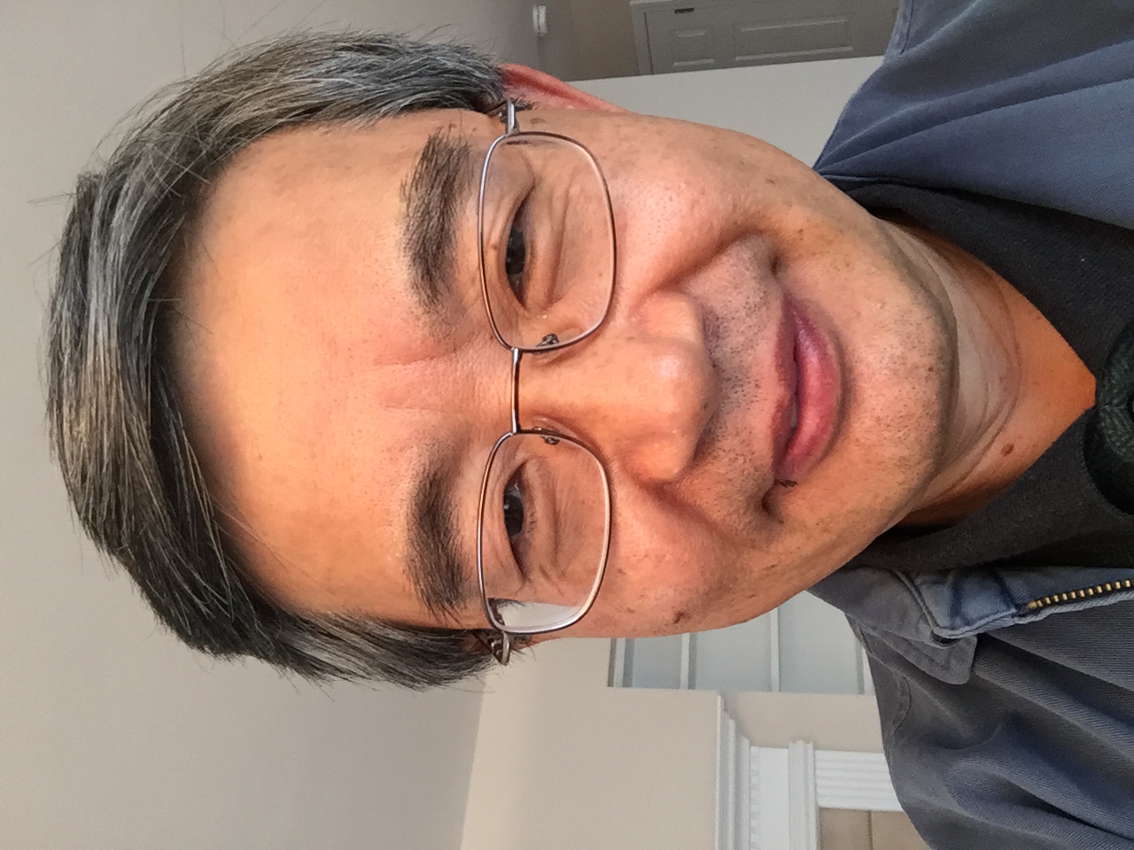 a close-up photo of Byung Lee's face.